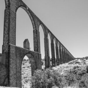 The ruins of an old structure in black and white