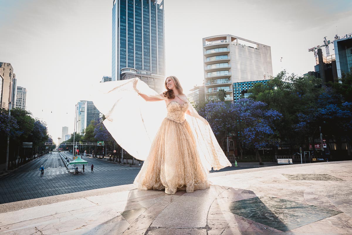 A woman in a sparkly gown and cape