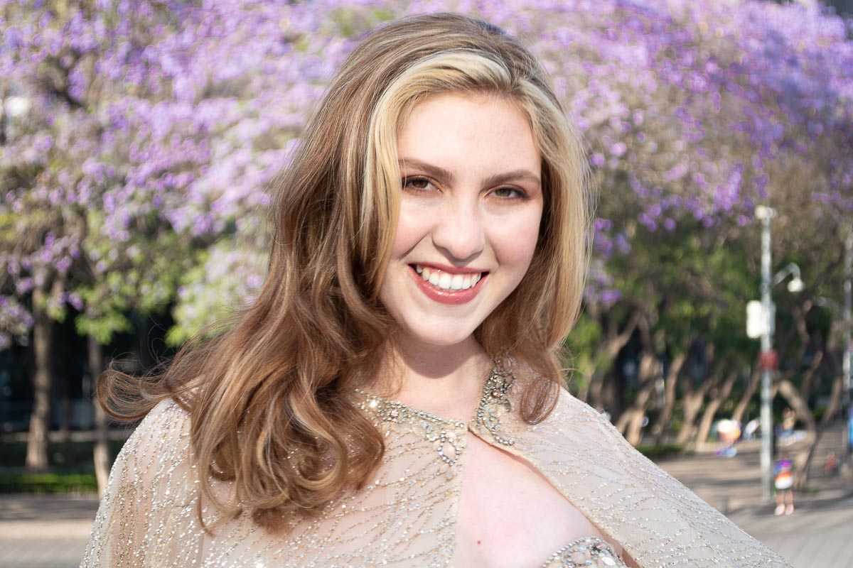 A long-haired woman smiling