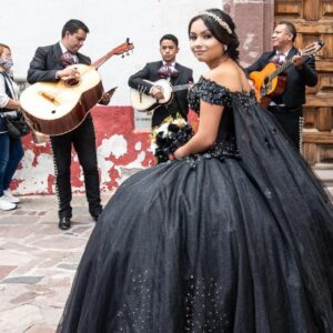 A mariachi band and a young lady in a black gown