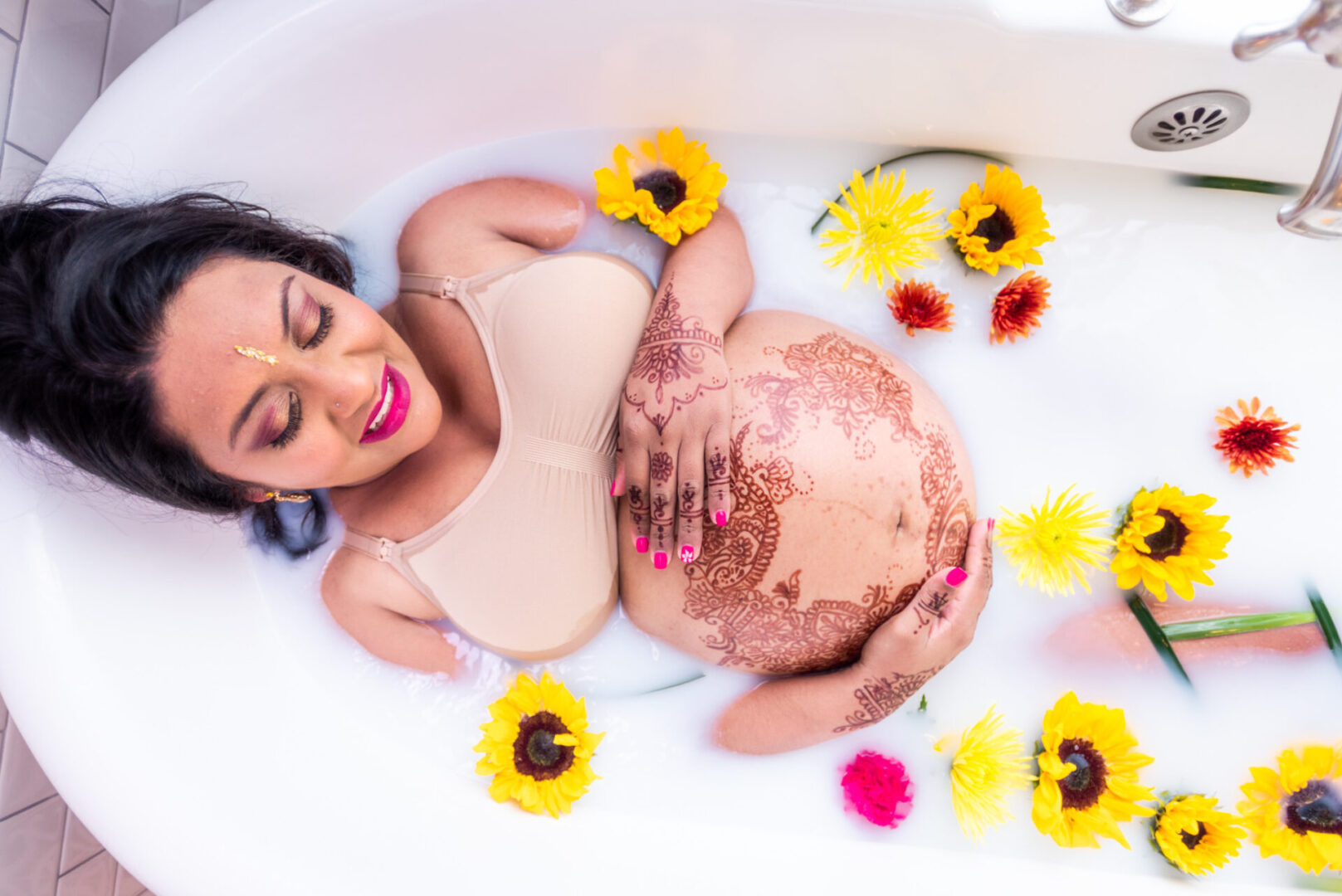 A pregnant lady in a bathtub