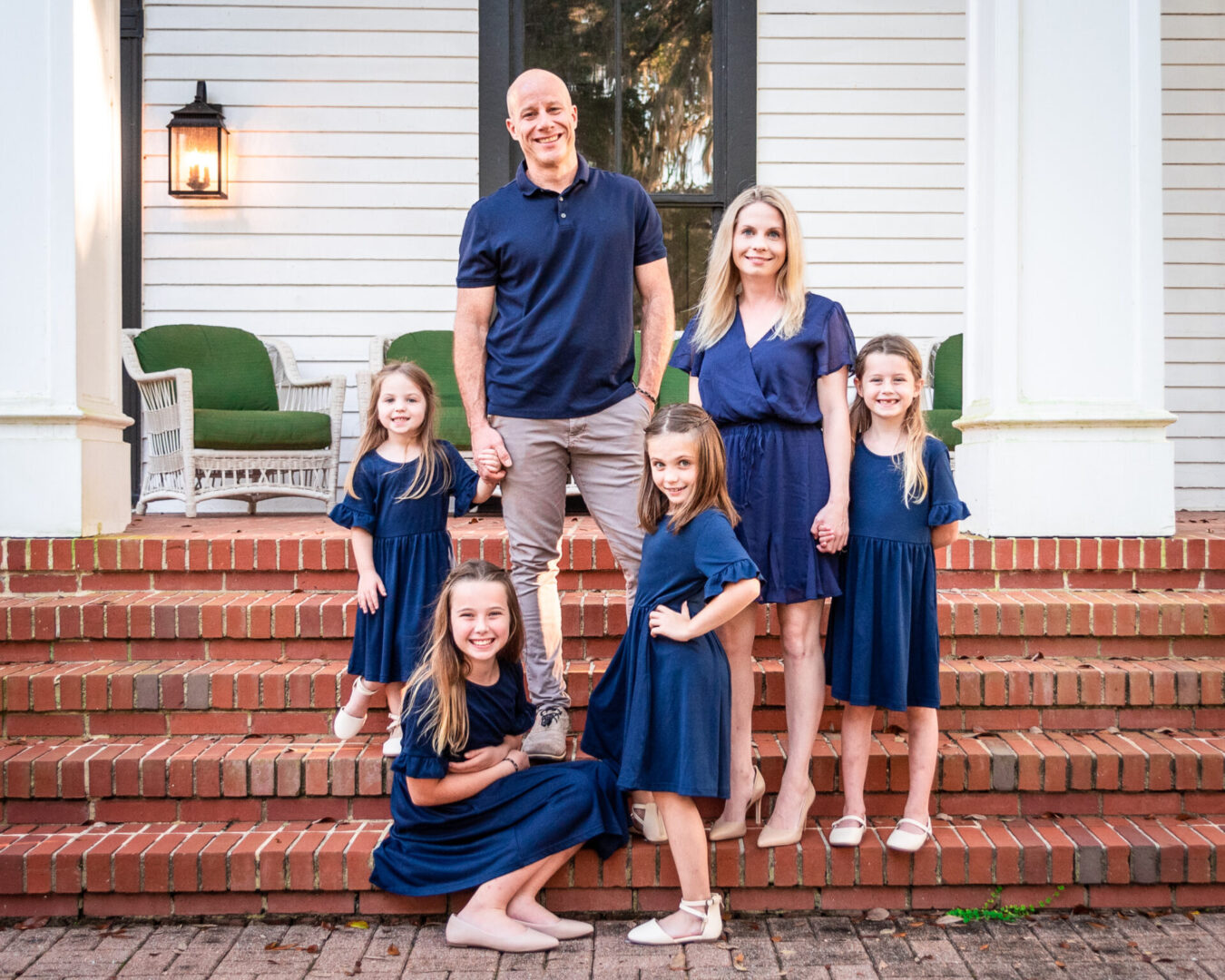 A big family posing for a picture on the stairs