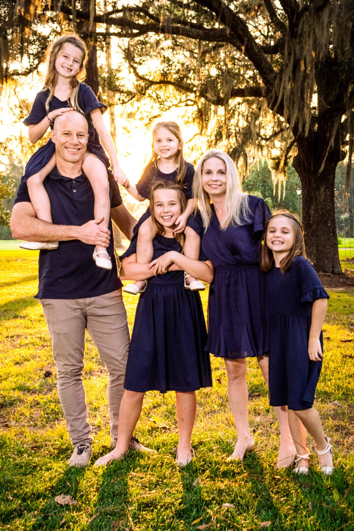 A big family all wearing navy blue clothing