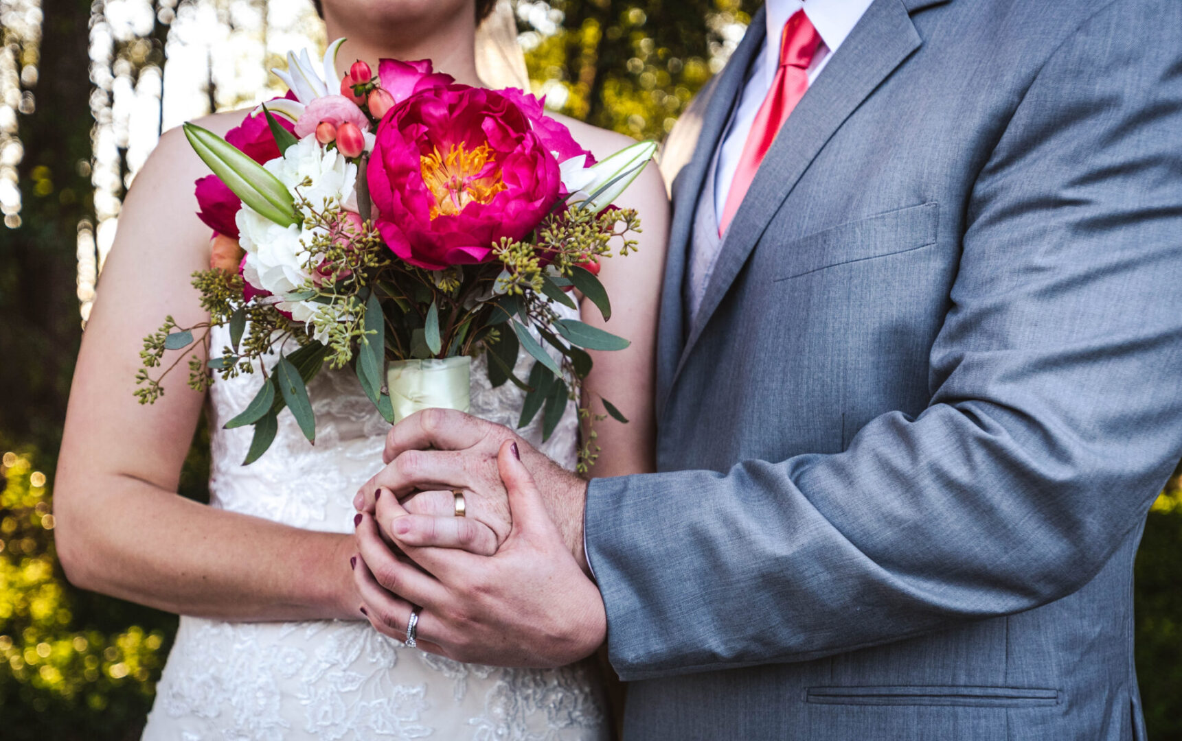 A Couple Holding a Flower Boquete