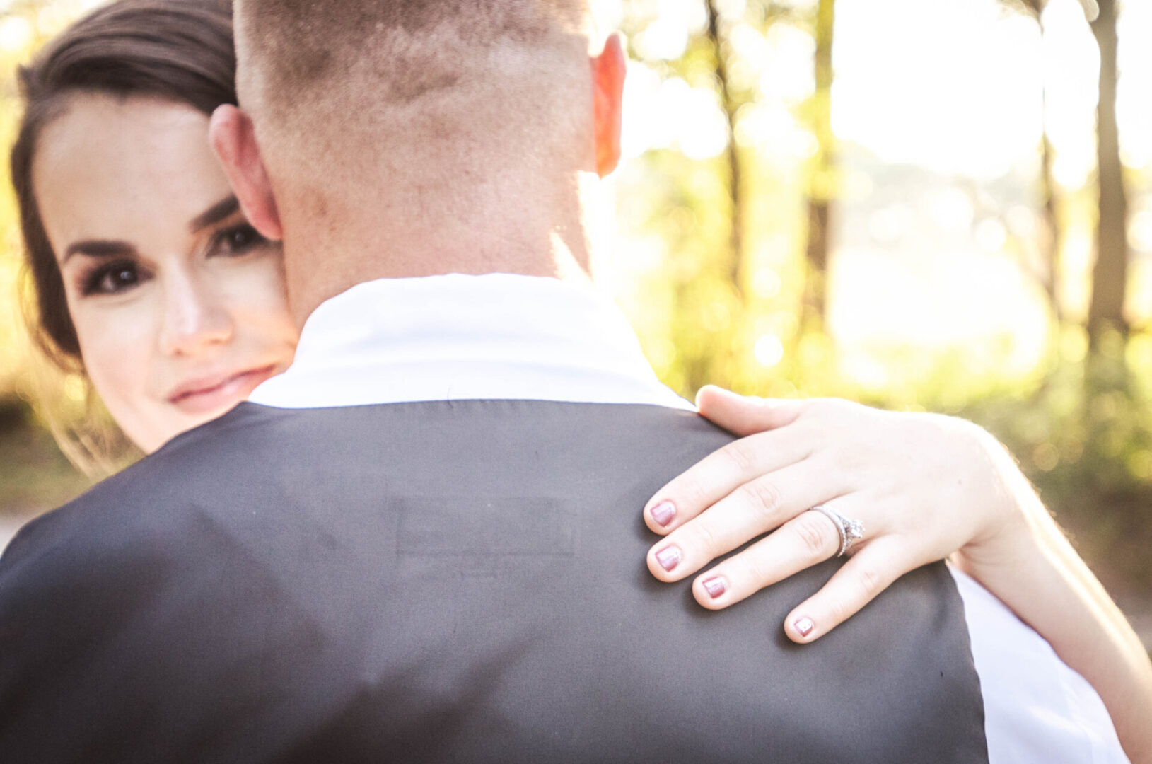 A bride hugging her groom