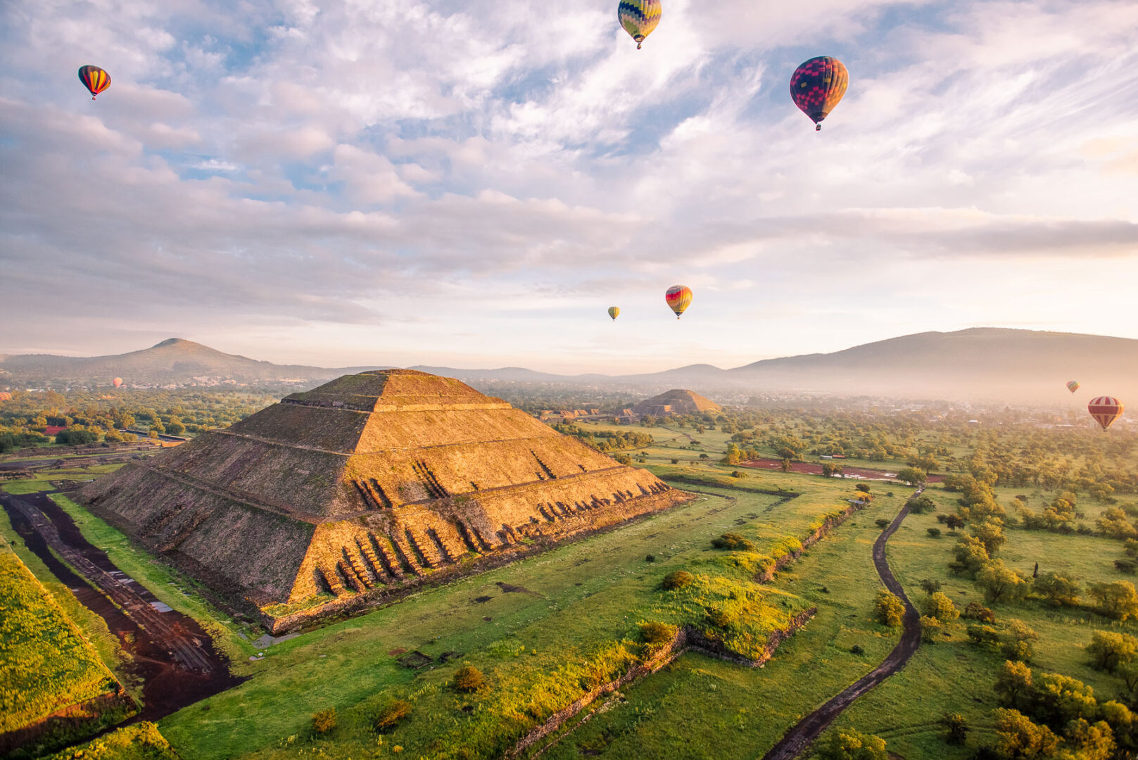 Hot balloons flying over old ruins